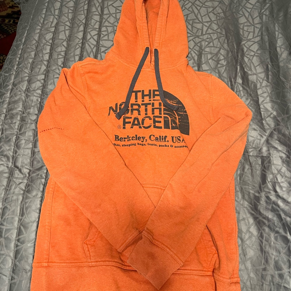 North face orange/salmon hoodie with some stains
